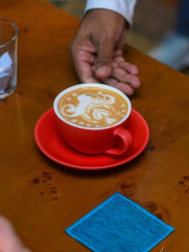 Lion latte art in a red cup