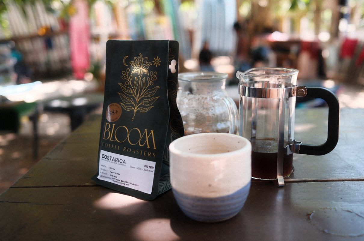 Filter coffee bag, cup and brewer on a table